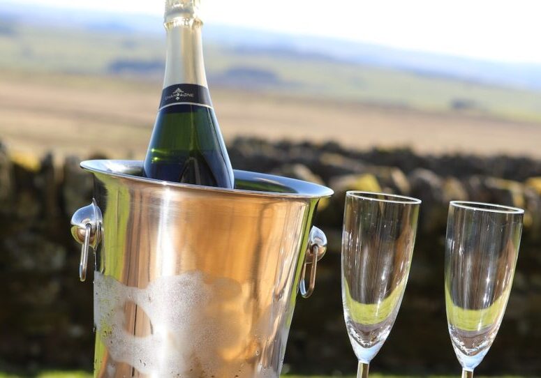 Ice bucket with Champagne and 2 Glasses