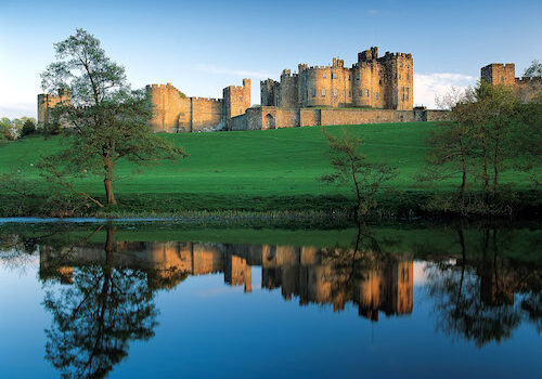 Alnwick Castle, Northumberland reflected in the lake